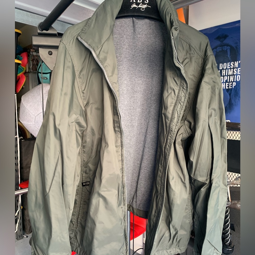 Moschino Jeans windbreaker with hood that ticks in collar. Size 38